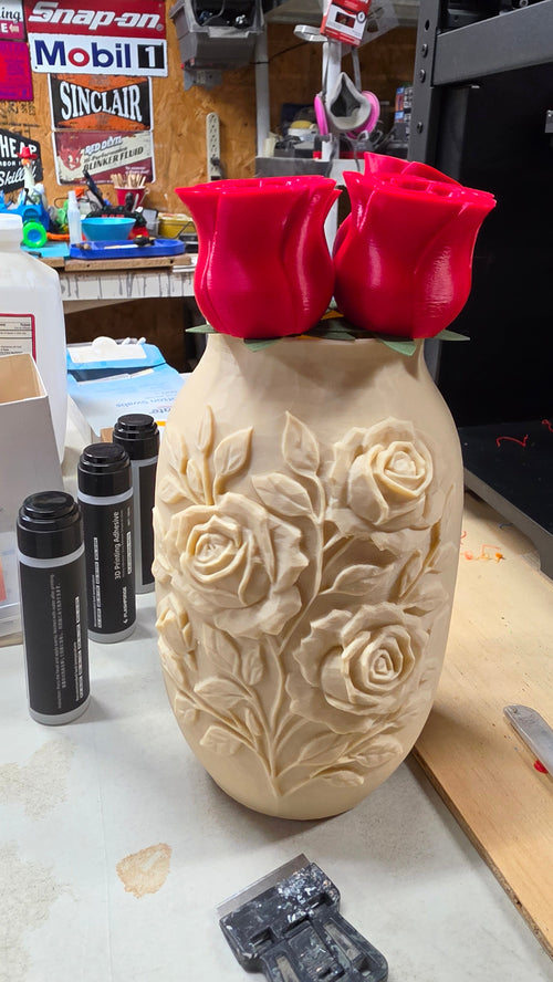3D printed vase with embossed rose design and red 3D printed roses