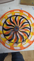 Custom 3D printed wind spinner in black, yellow, and orange